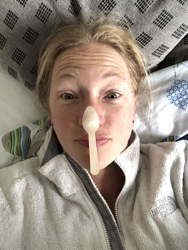 Wooden spoon on nose
